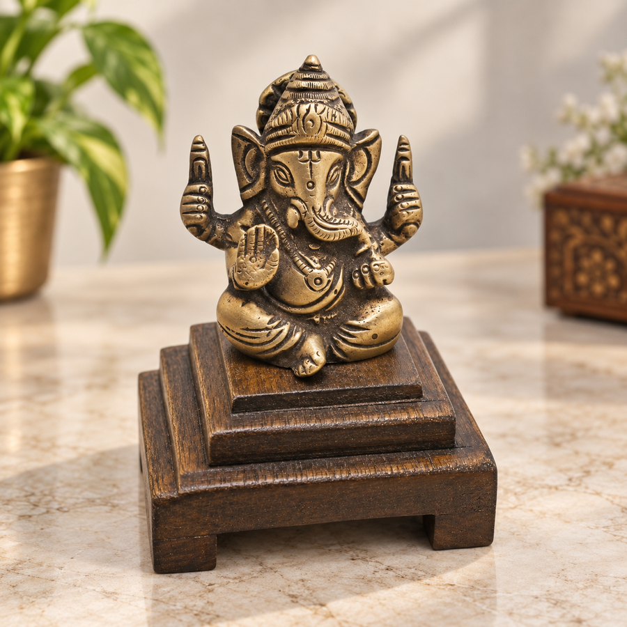 Handcrafted brass Lord Ganesha statue on wooden Bajot base, front view
