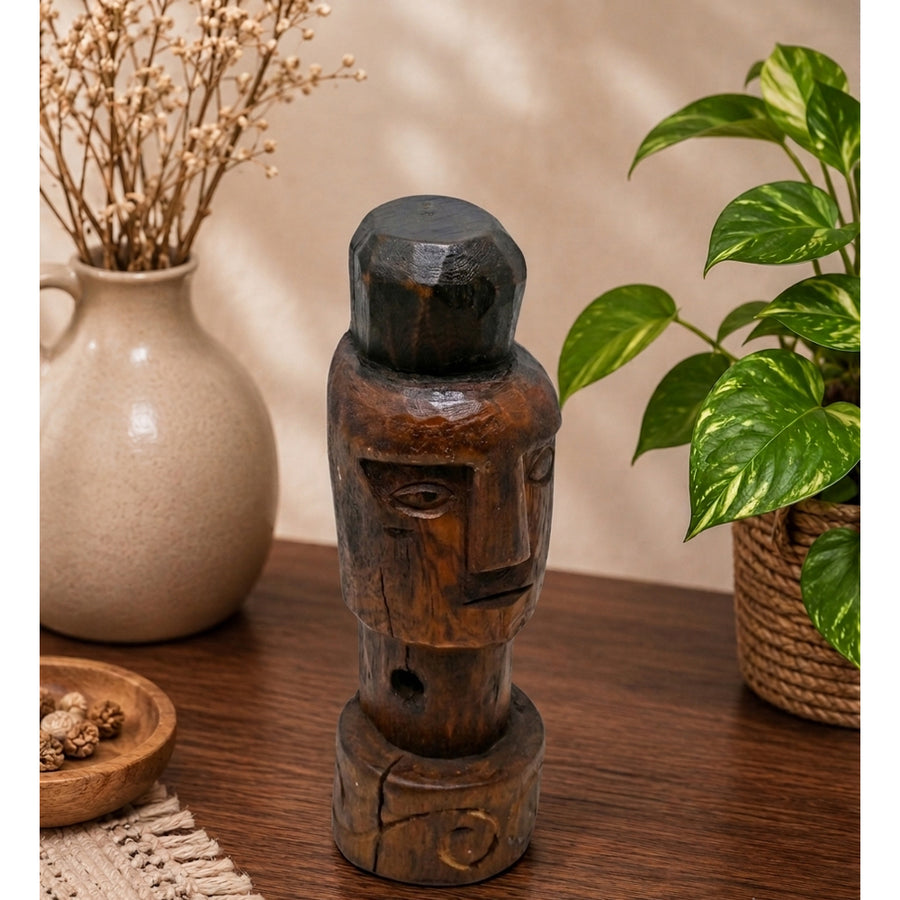 Handcrafted tribal wooden face sculpture in dark brown rustic finish, product view 1