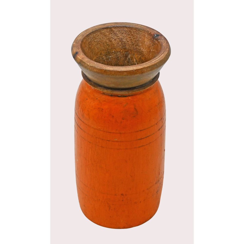 Handcrafted wooden flower pot in orange finish, close-up detail