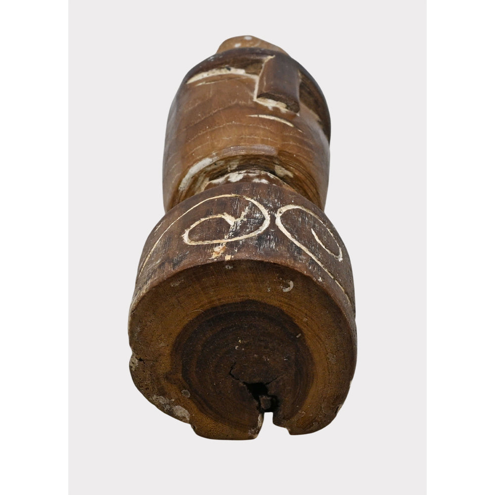 Rustic tribal wooden head sculpture, carved texture detail