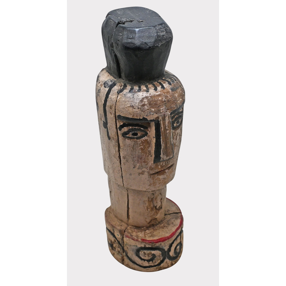 Whitewashed wooden tribal face sculpture, angled view