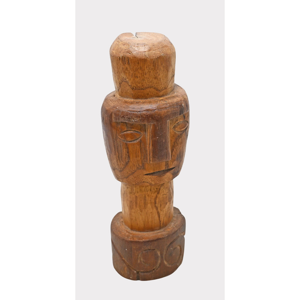 Natural wood tribal face sculpture, angled view