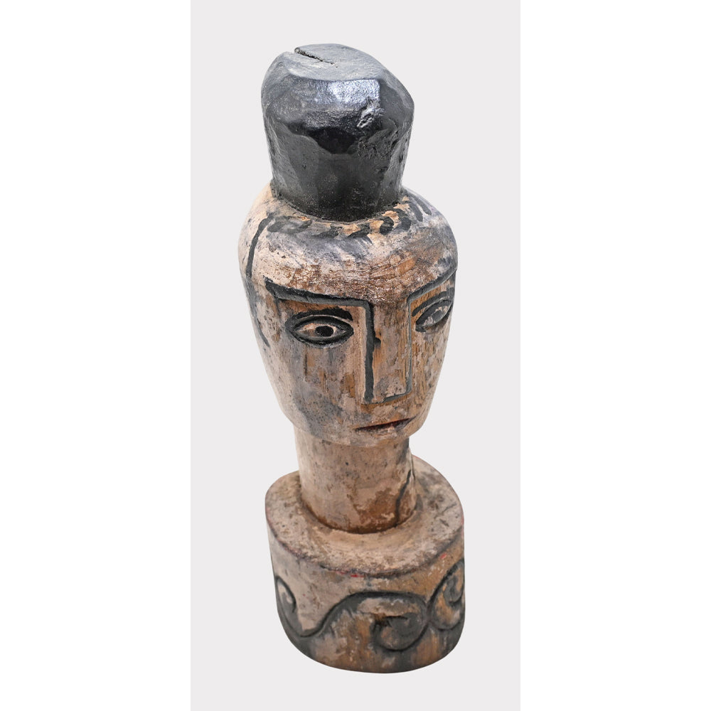 Whitewashed tribal wooden face, angled view