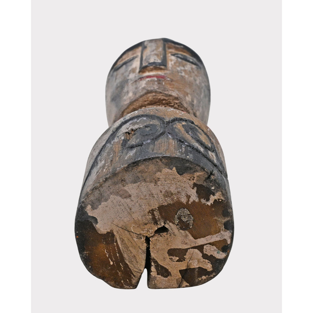 Whitewashed tribal face sculpture, side view