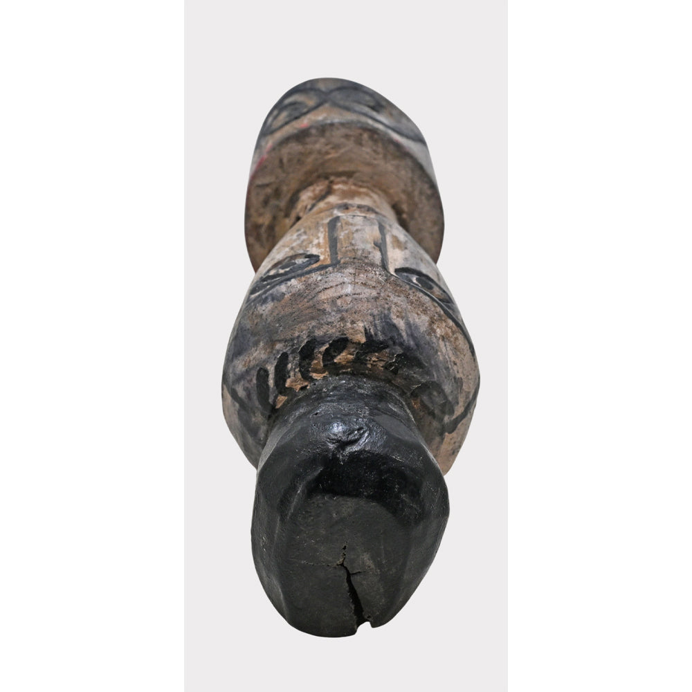 Wooden tribal face sculpture showing whitewashed finish