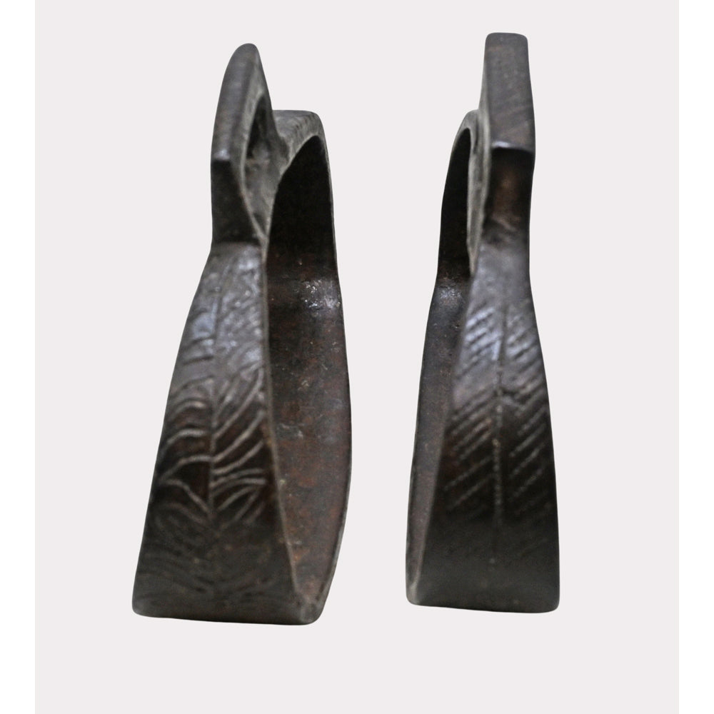 Close-up of hand-forged iron stirrup surface and detailing
