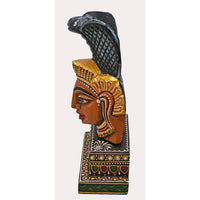 Nag Devta wooden idol with decorative base, side view