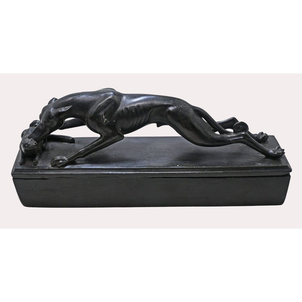Close-up of carved black stone hunting dog details