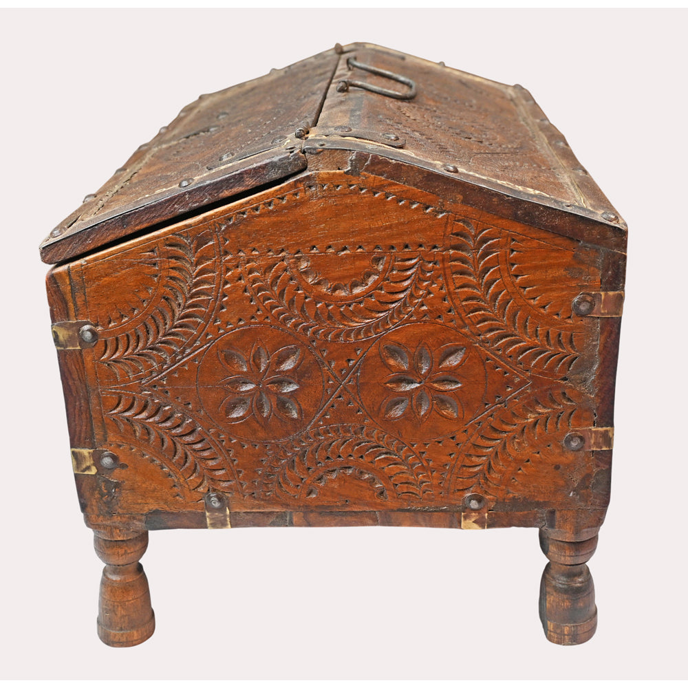 Mango wood treasure chest with iron and brass fittings, close-up of decorative details