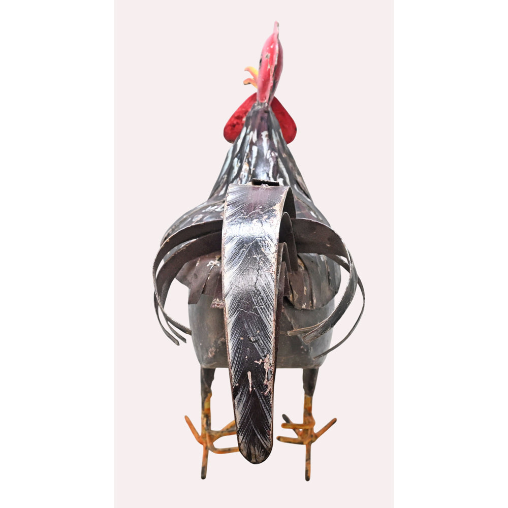Black and red rust iron rooster figurine, side view