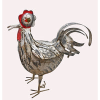 White and rust iron rooster figurine, angled view