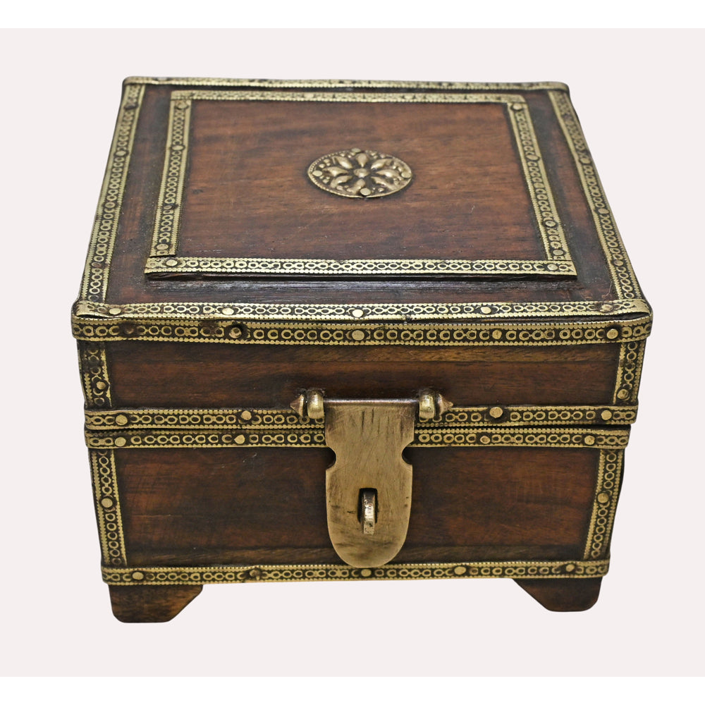 Handcrafted wooden trinket box with brass details, angled view