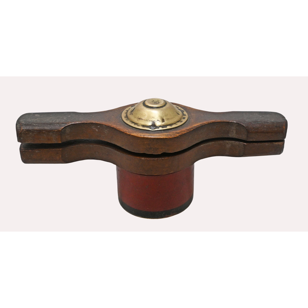 Close-up of brass details on vintage wooden hand juicer