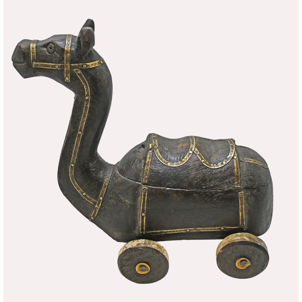 Close-up of camel design and brass work on spice box