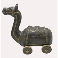 Close-up of camel design and brass work on spice box
