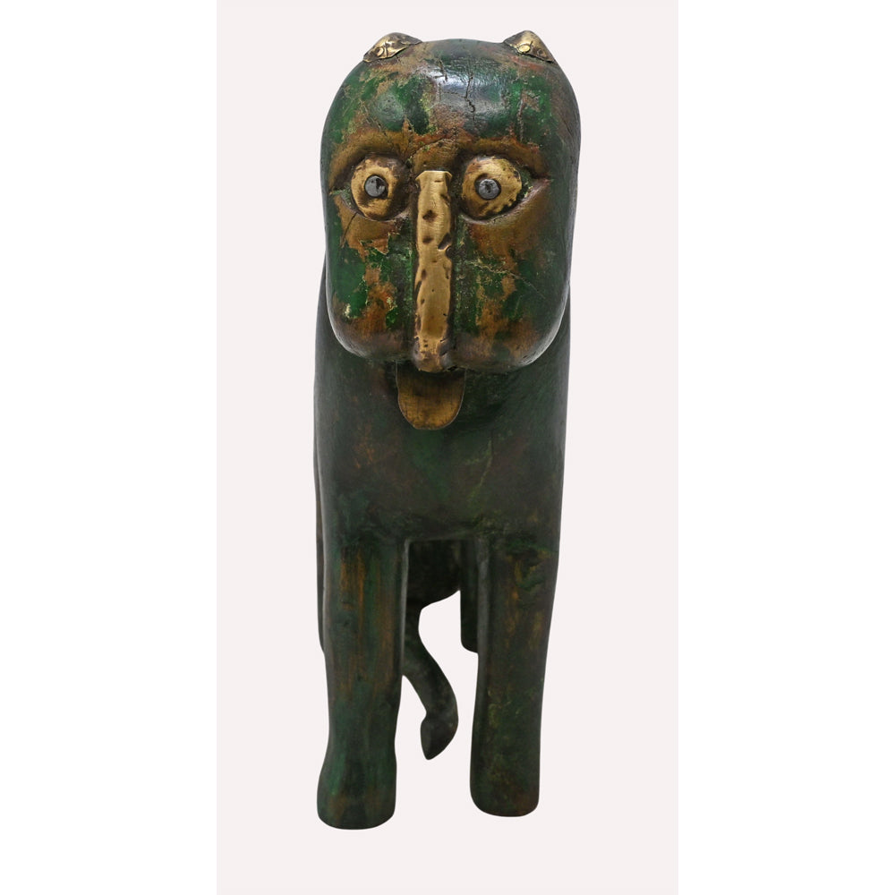 Wooden lion figurine with brass details, angled view