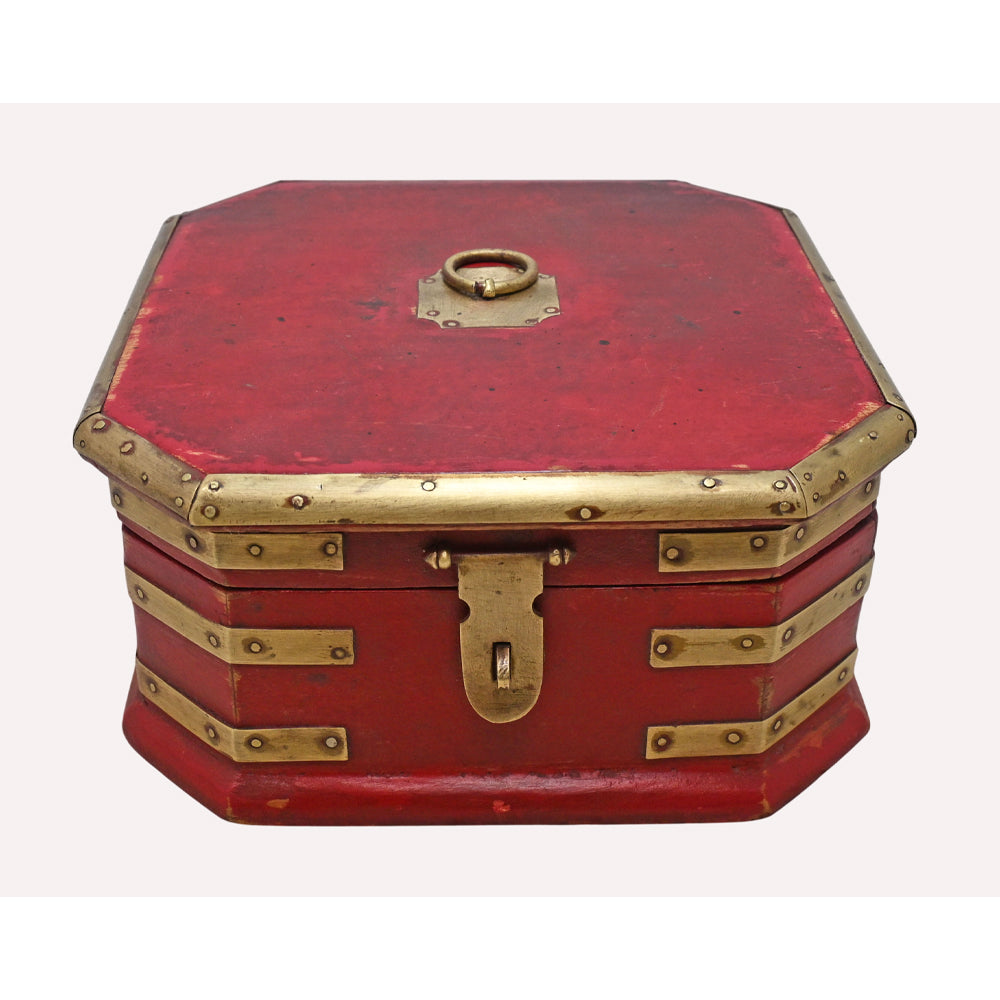 Red wooden jewellery box with brass detailing, angled view