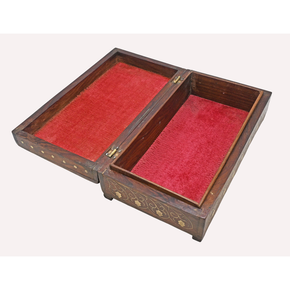 Close-up of floral brass inlay on octagonal wooden jewellery box