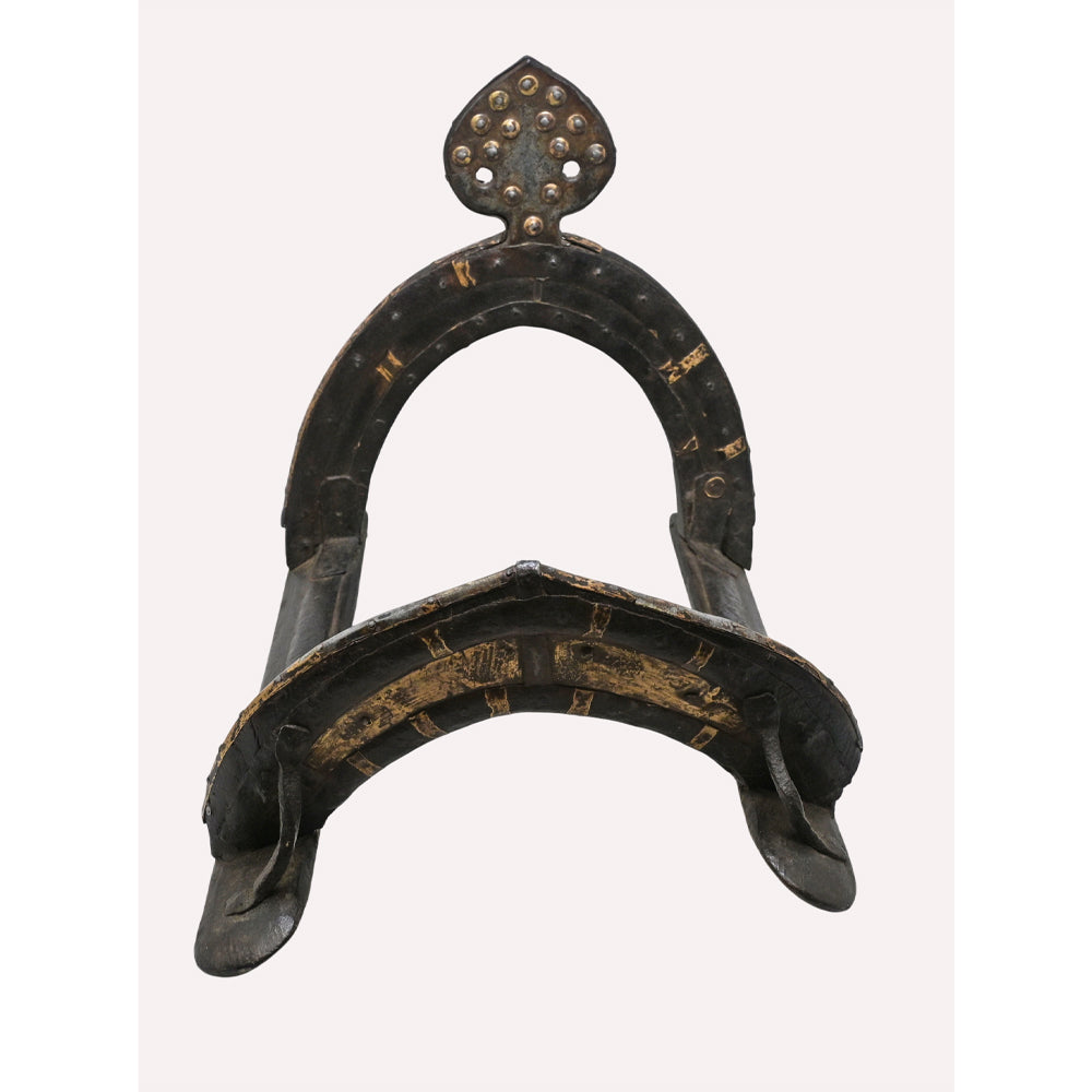Close-up of metalwork on antique horse riding saddle