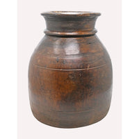 Single-piece carved wooden grain pot, angled view