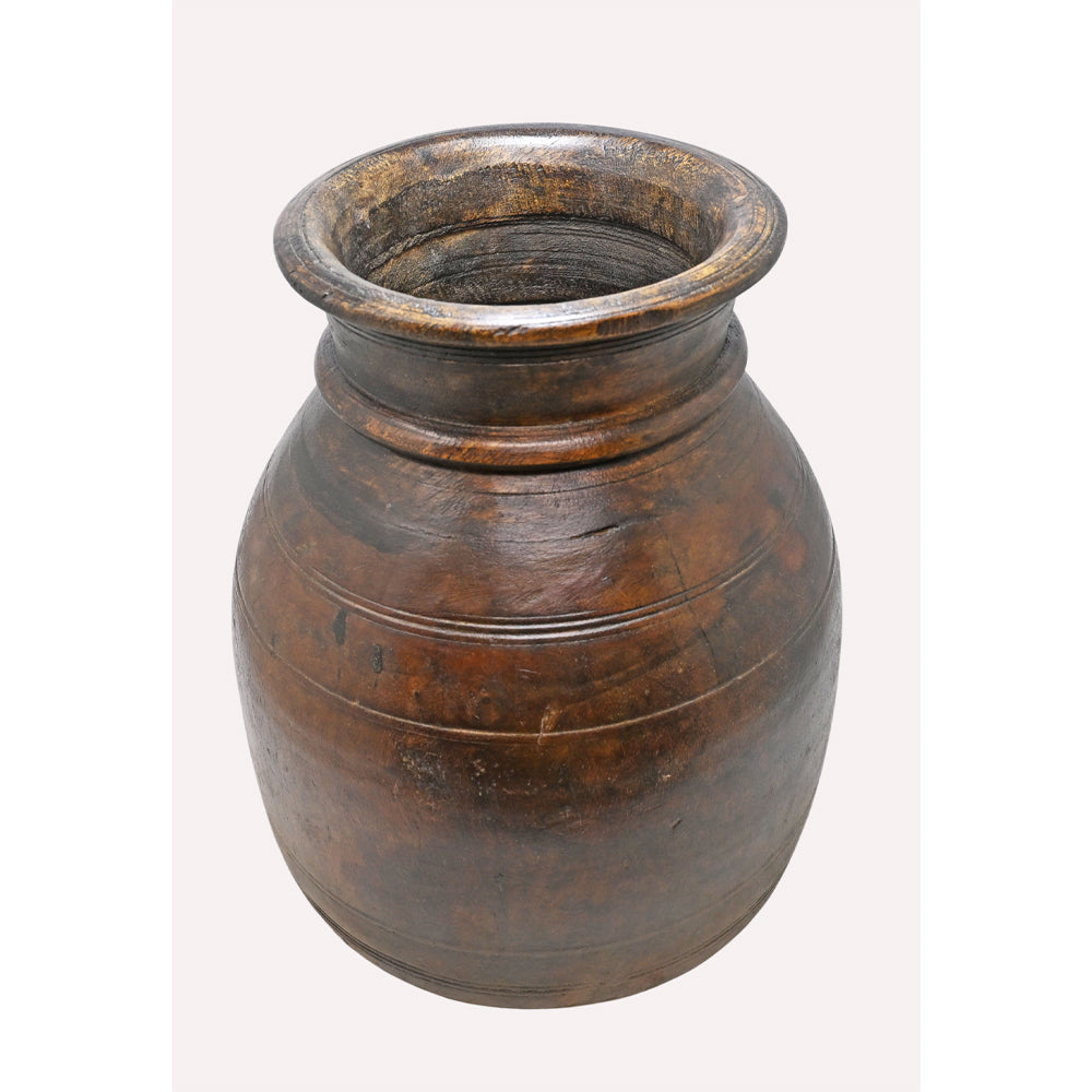 Close-up of traditional carving on wooden grain pot