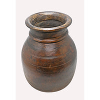 Close-up of traditional carving on wooden grain pot