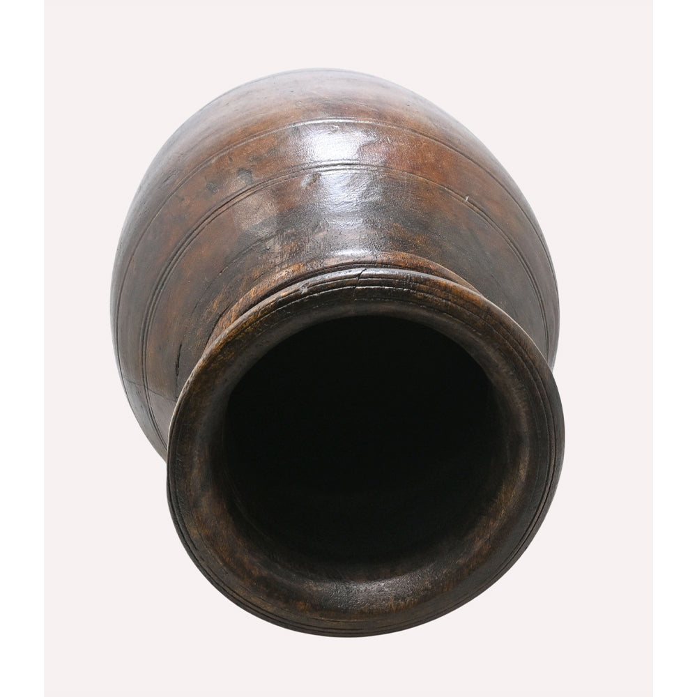 Wooden grain pot showing its turned decorative form