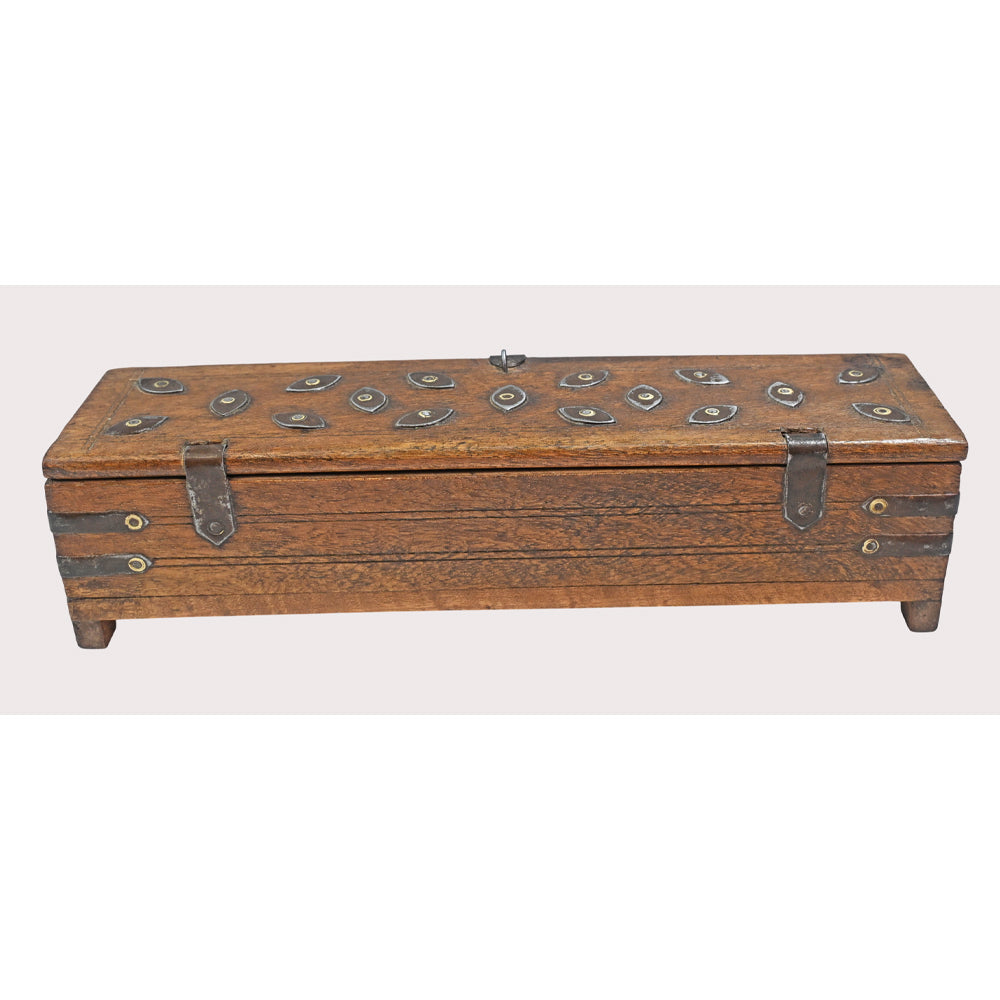 Close-up of iron and brass details on pencil box