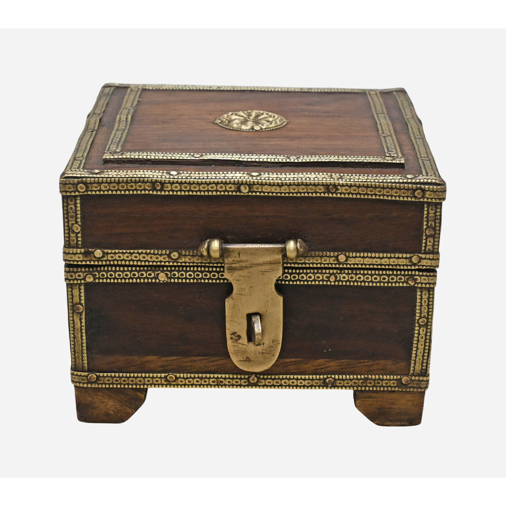 Angled view of wooden keepsake box with brass accents