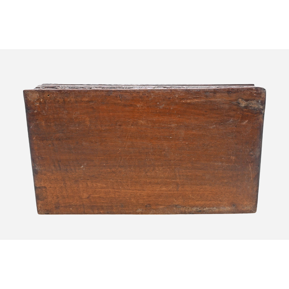 Detailed carved floral pattern on wooden jewellery box