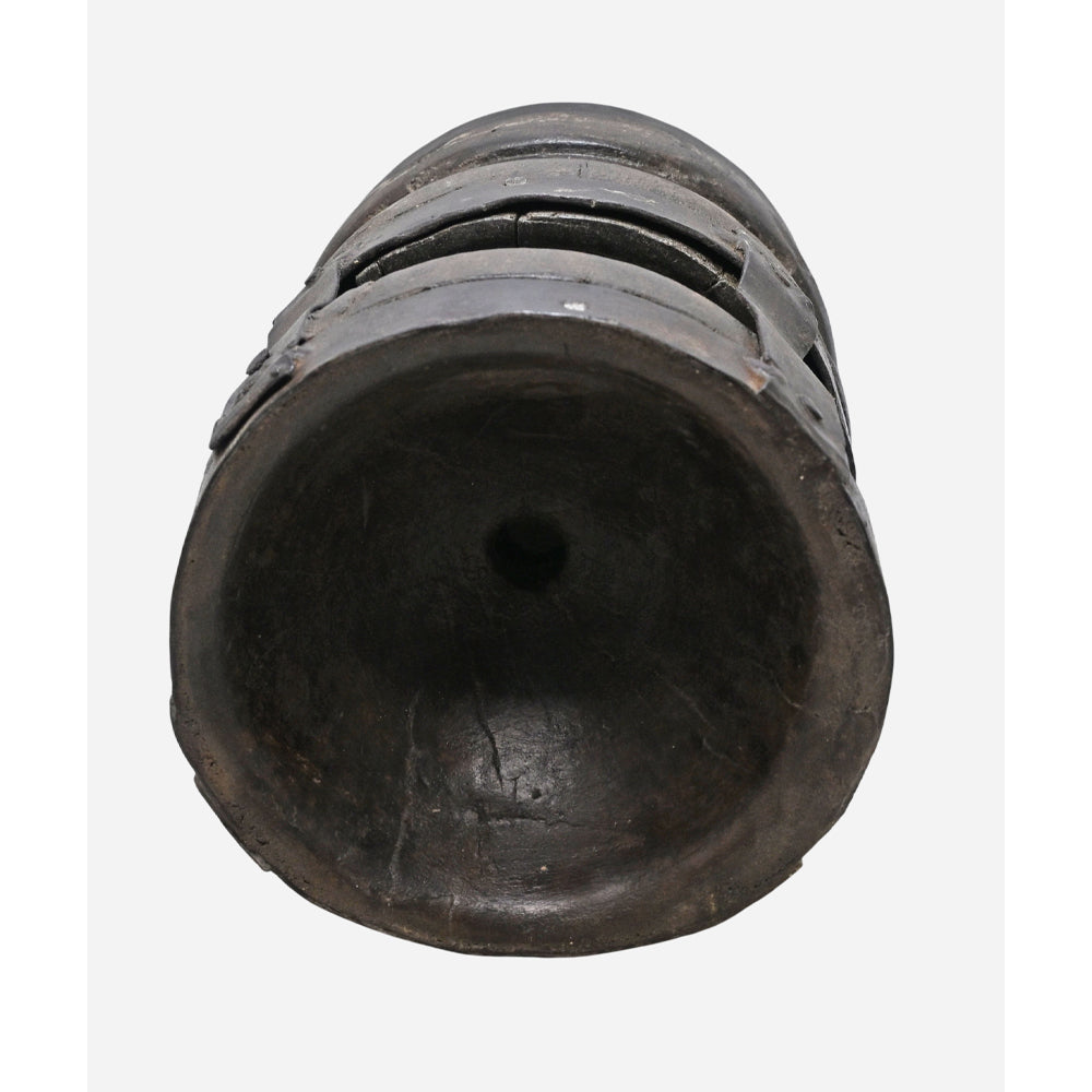 Side view of traditional wooden seed holder