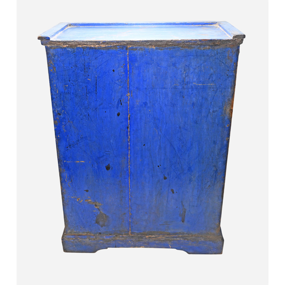 Close-up of distressed blue finish on wooden storage drawers