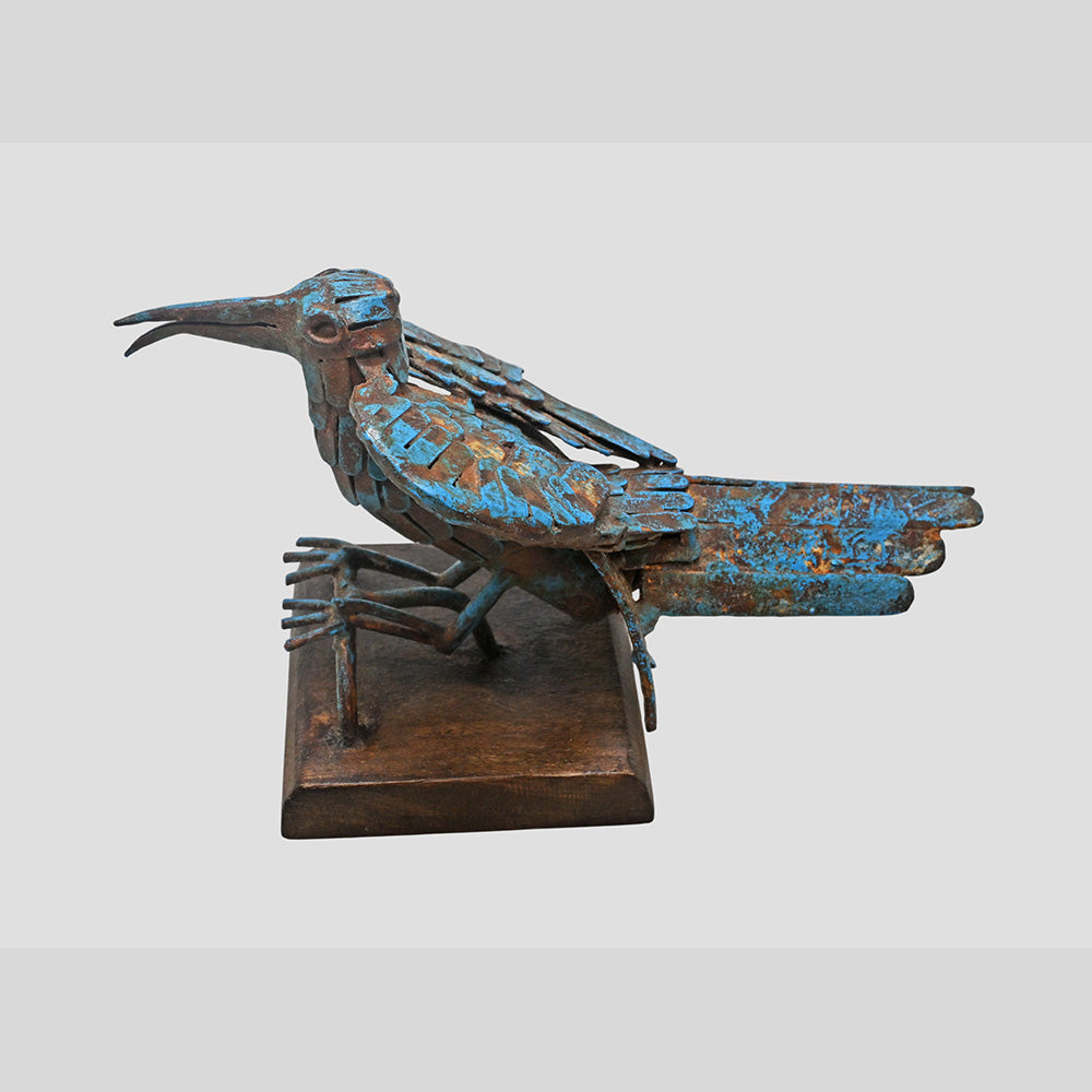 Blue antique iron bird sculpture, angled view