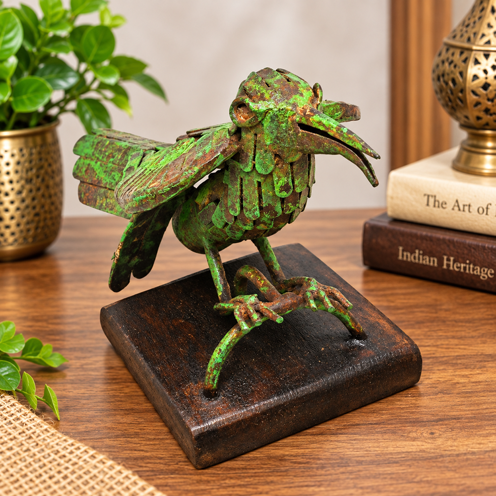 Green antique iron bird figurine on wooden base, front view