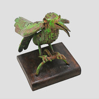 Green antique iron bird sculpture, angled view