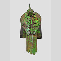 Green iron bird figurine showing wooden base