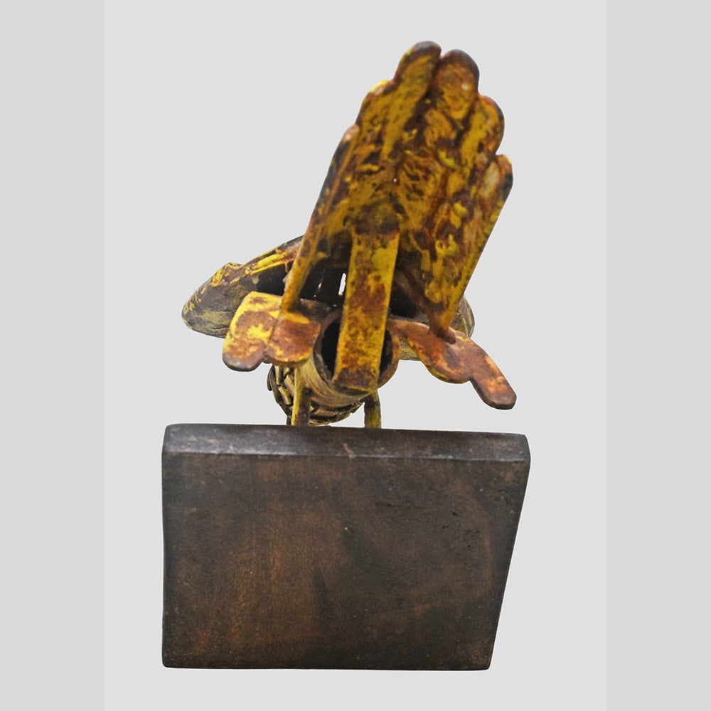 Yellow antique iron bird figurine, alternate view