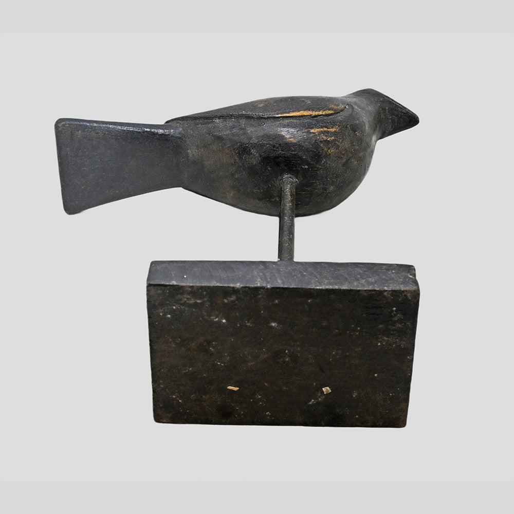 Black antique wooden bird figurine on stand, alternate view