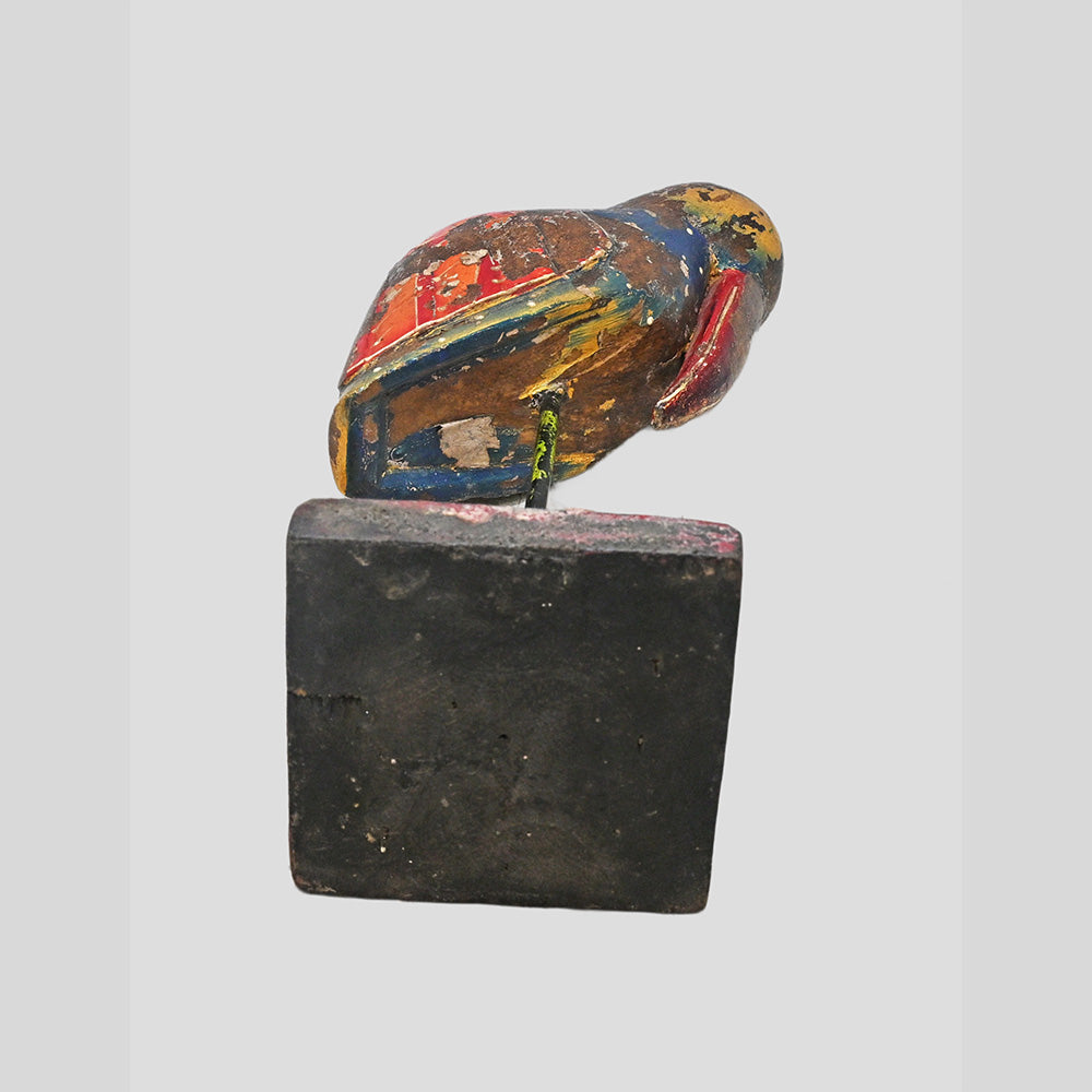 Alternate view of multicolor wooden bird figurine on red decorative base
