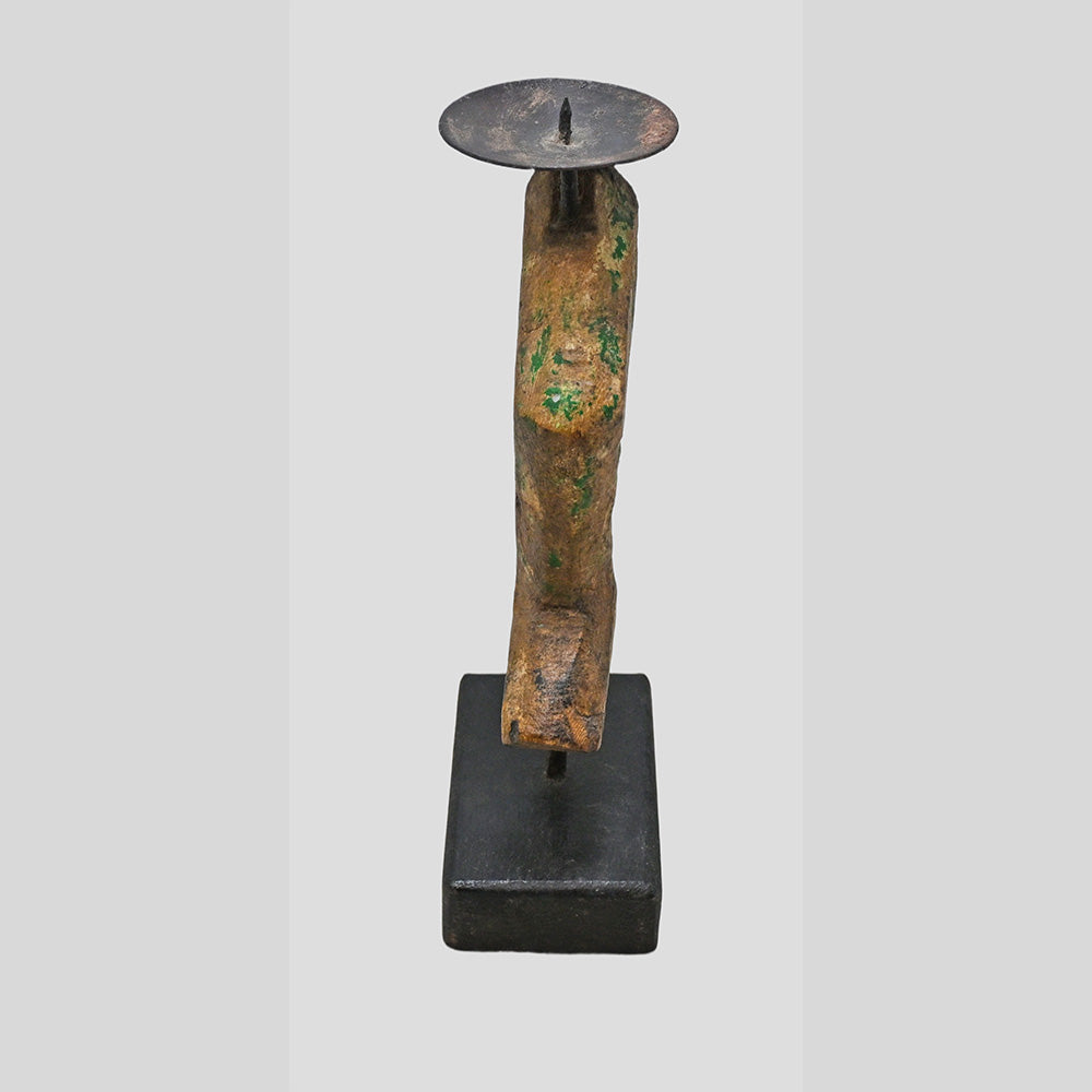 Side view of rustic wooden candle holder on rectangular base