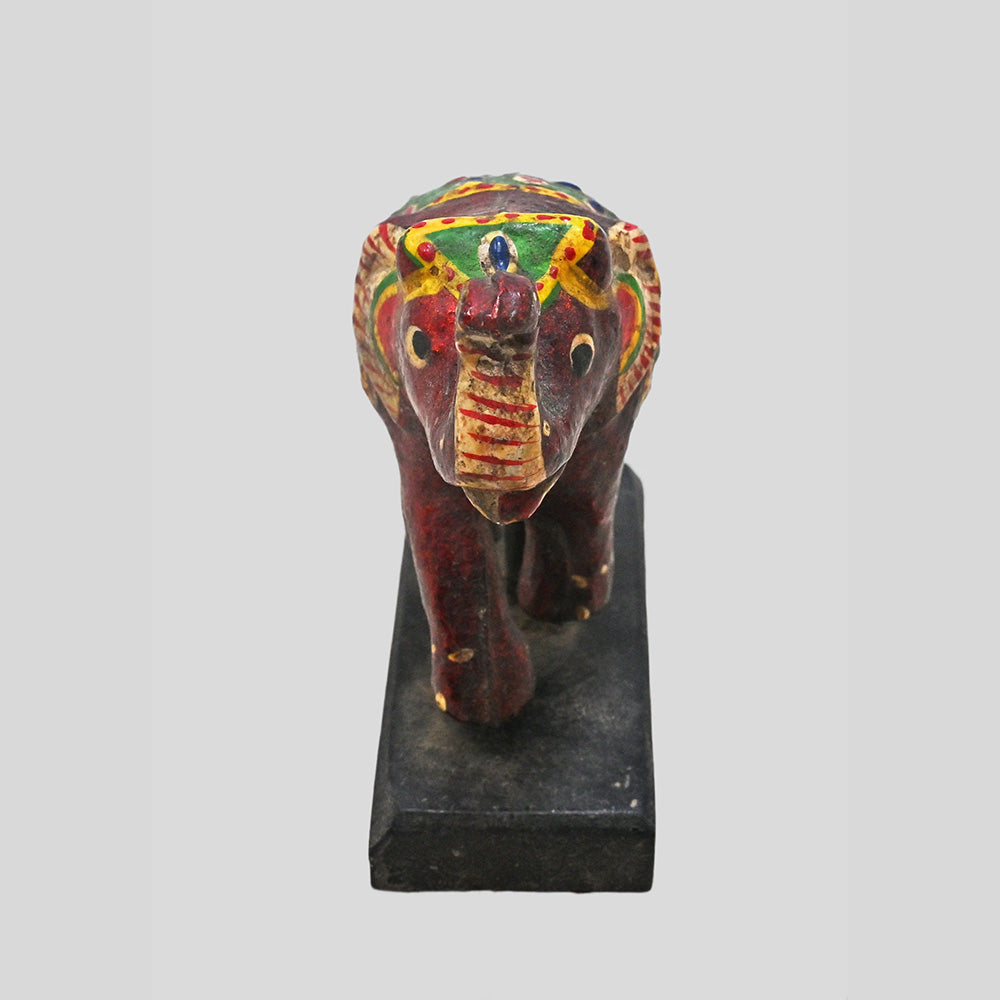 Close-up of traditional painted patterns on wooden elephant figurine