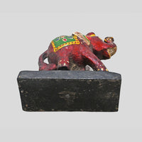 Alternate view of colorful wooden elephant figurine on display base