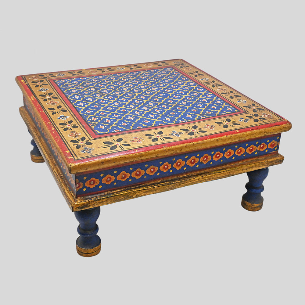 Angled view of traditional wooden Bajot Chowki with painted top