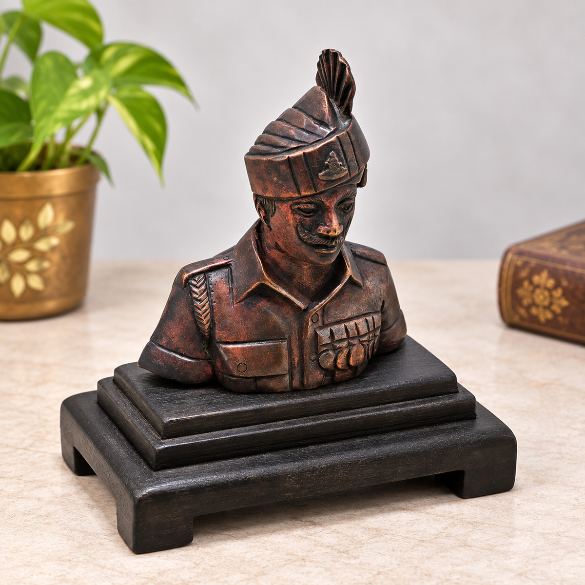 Antique handcrafted brass soldier bust on wooden base, front view