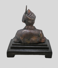 Antique brass soldier bust showing wooden display base, side view