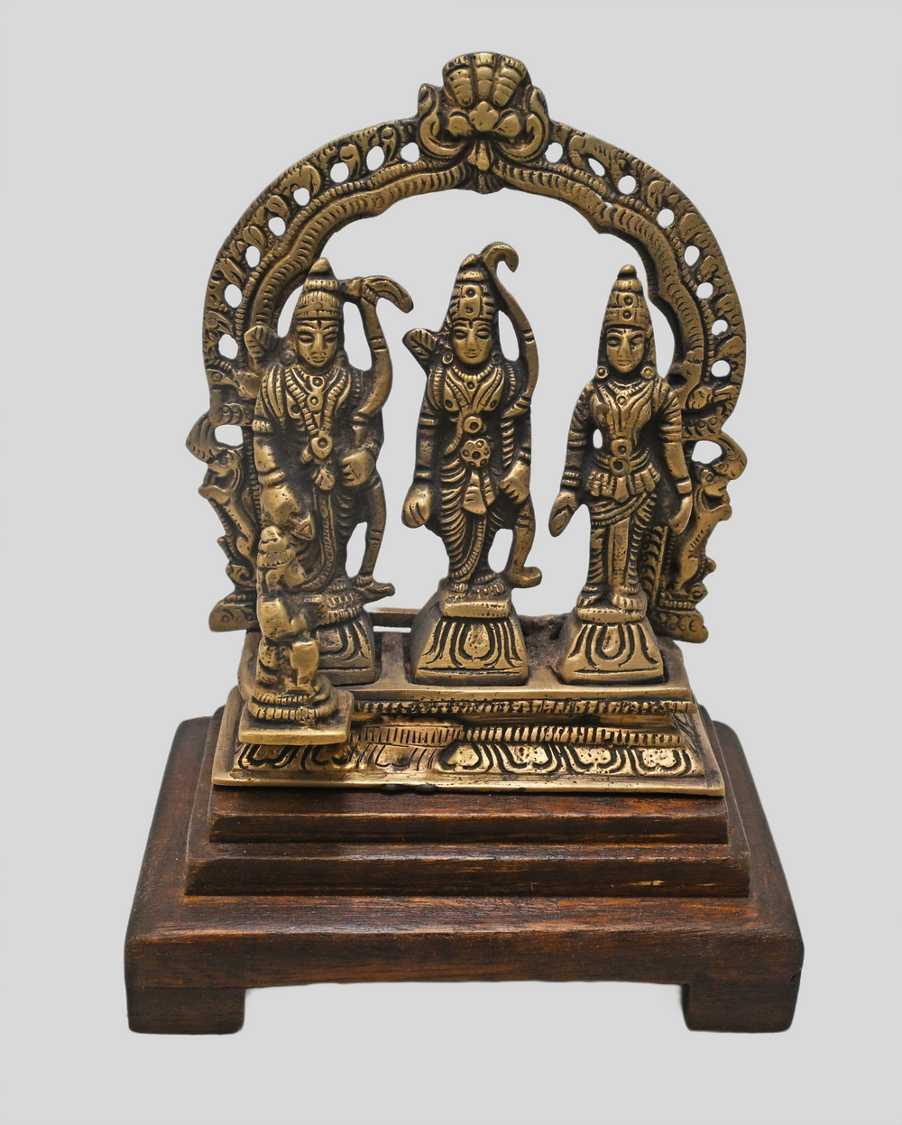 Brass Ram Darbar statue on wooden base, angled view