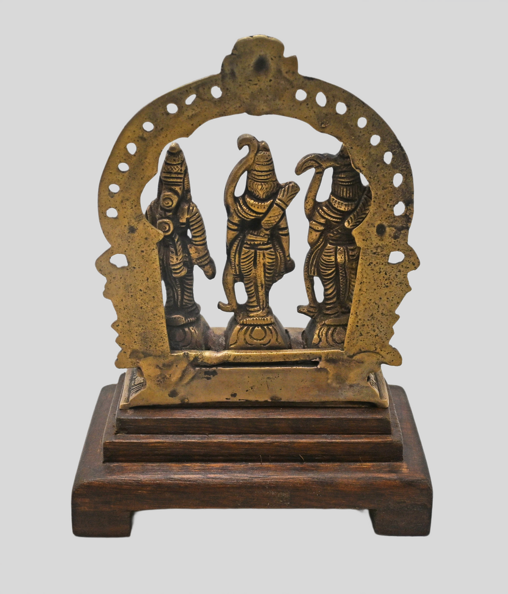 Brass Ram Darbar statue showing wooden display base