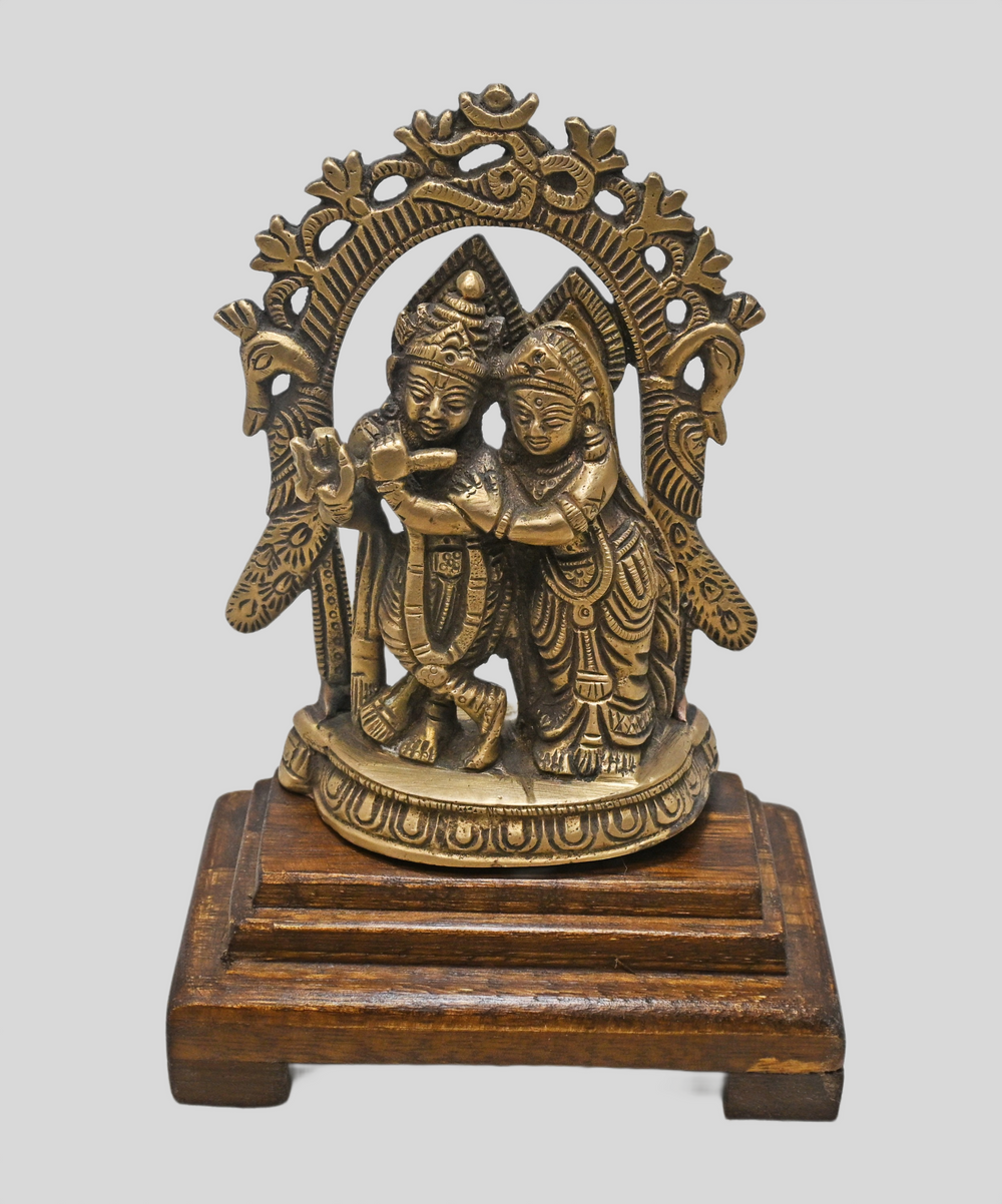 Brass Radha Krishna statue with flute, angled view