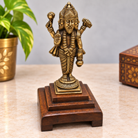 Handcrafted brass four-faced Lord Brahma statue on wooden base, front view