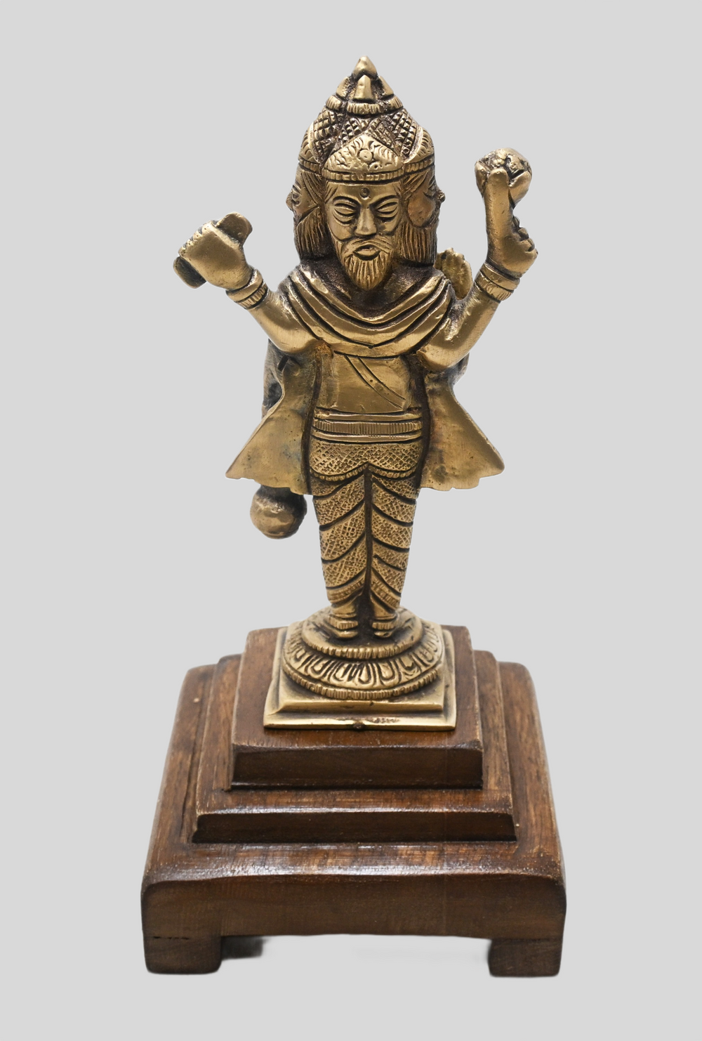 Brass Lord Brahma statue showing wooden Bajot base
